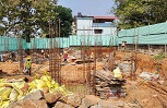 Steel columns are erected on the ground.