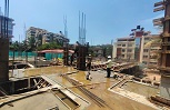 Workers are making steel columns to strength the structure.