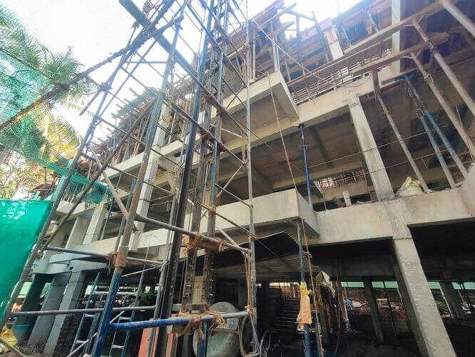 Elevator is being built using a bamboo structure.