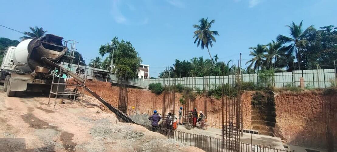 Concrete truck mixer is used to fill out the foundation.