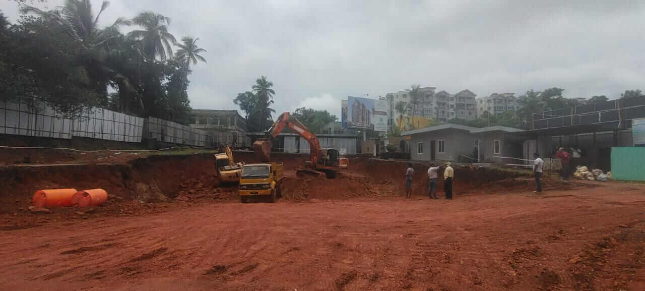 A truck is being loaded with mud from the site.