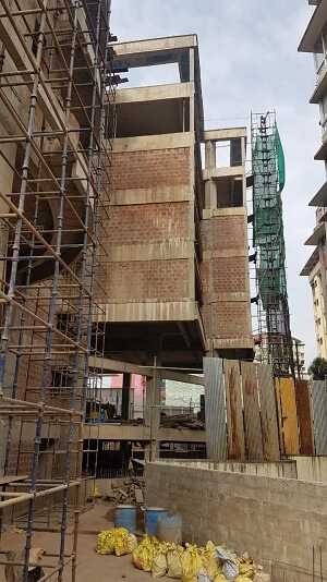 The scaffolding is present in the exterior, which workers use to mobilize themselves.