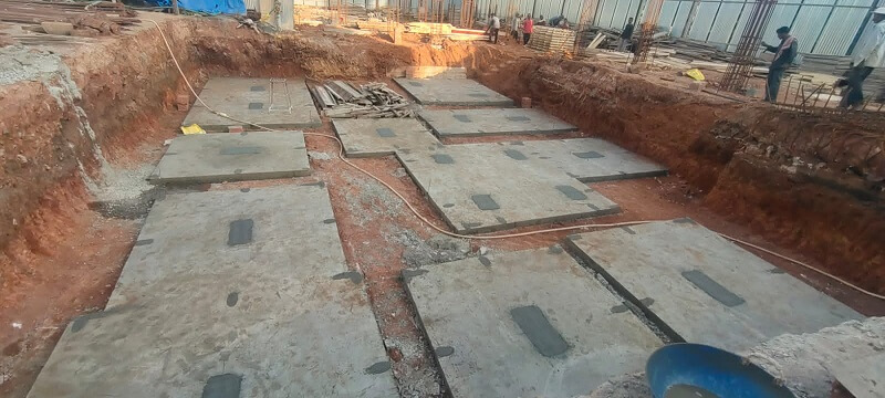 Concrete slabs are applied to lay out the foundation.